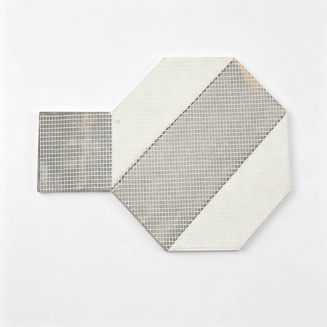 Back view of brown and white geometric marble mosaic tile with mesh backing