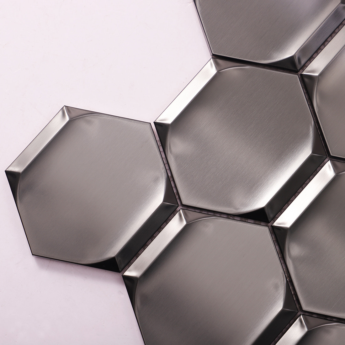 Corner detail of brushed black 3D hexagon stainless steel mosaic tile