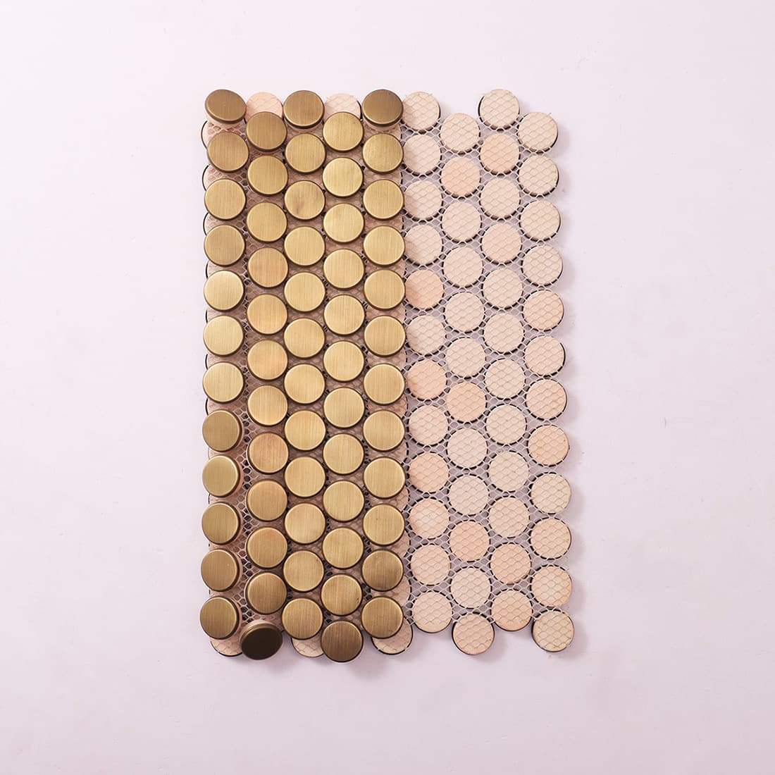 Back view of brushed brass penny round metal mosaic tile with mesh backing