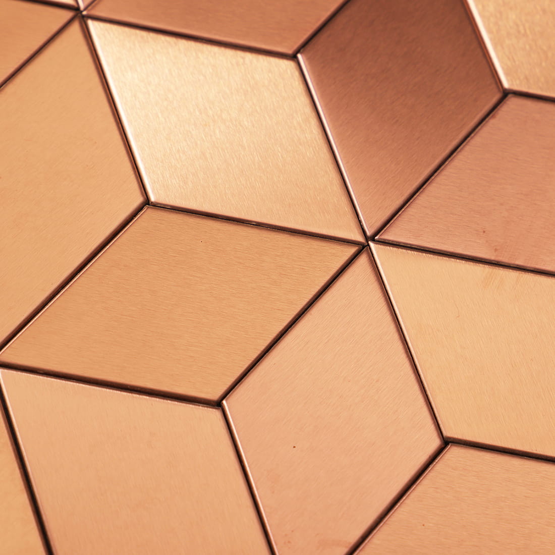 Close-up of brushed rose gold cube stainless steel mosaic pattern