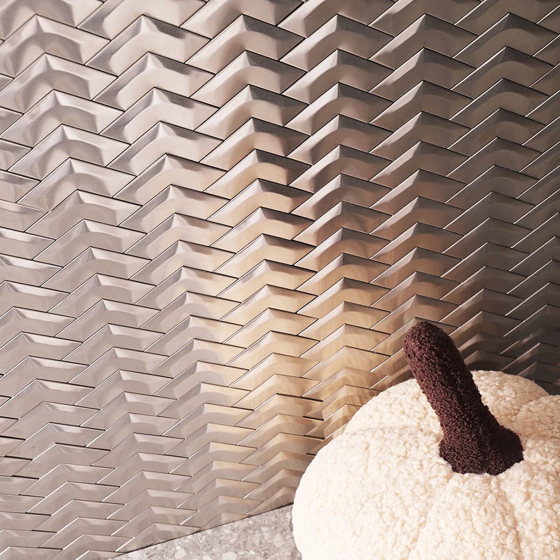 Interior scene with brushed silver chevron stainless steel mosaic tile