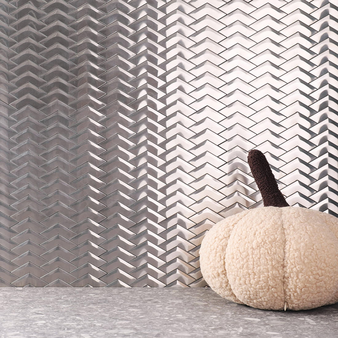 Brushed silver chevron stainless steel mosaic tile wall with pumpkin decor