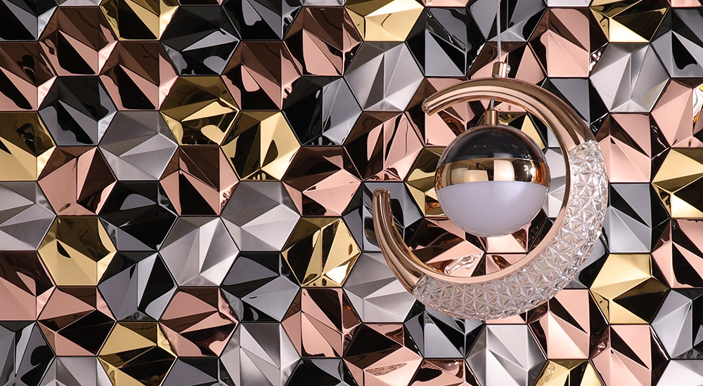 {"default":"Close up detail of 3D hexagonal stainless steel tiles in mixed metallic colors for backsplash."}
