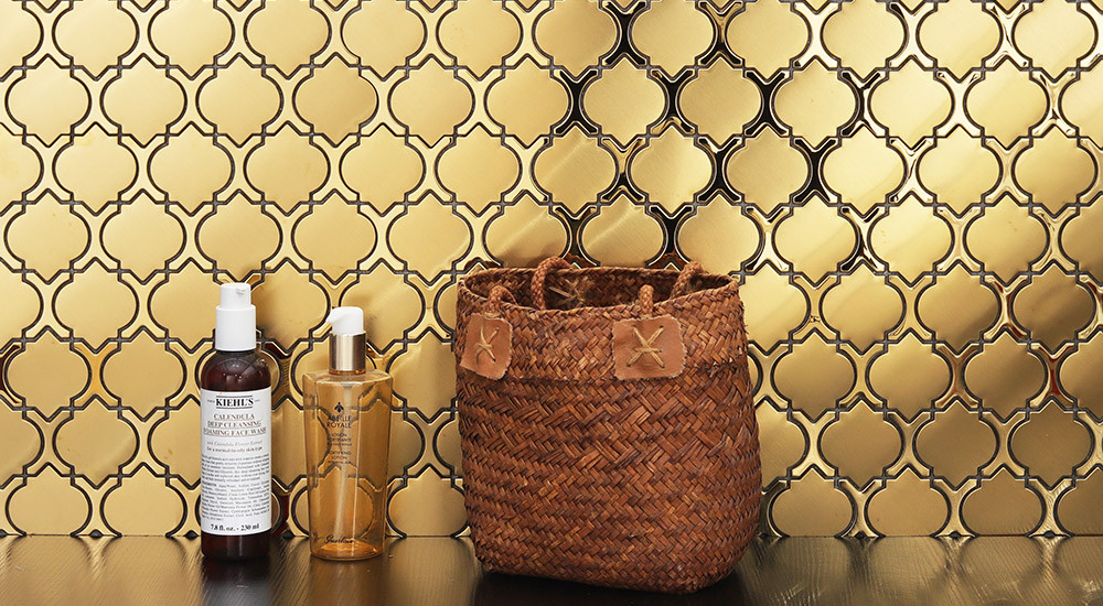 {"default":"Gold lantern arabesque mosaic tile backsplash with bathroom accessories."}
