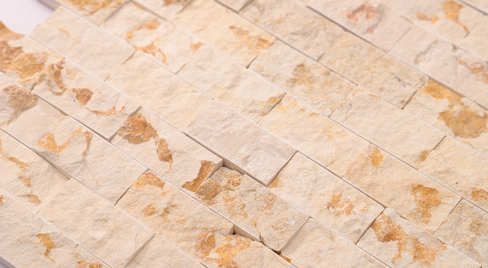 {"default":"Close-up of green and white geometric marble mosaic wall tiles."}
