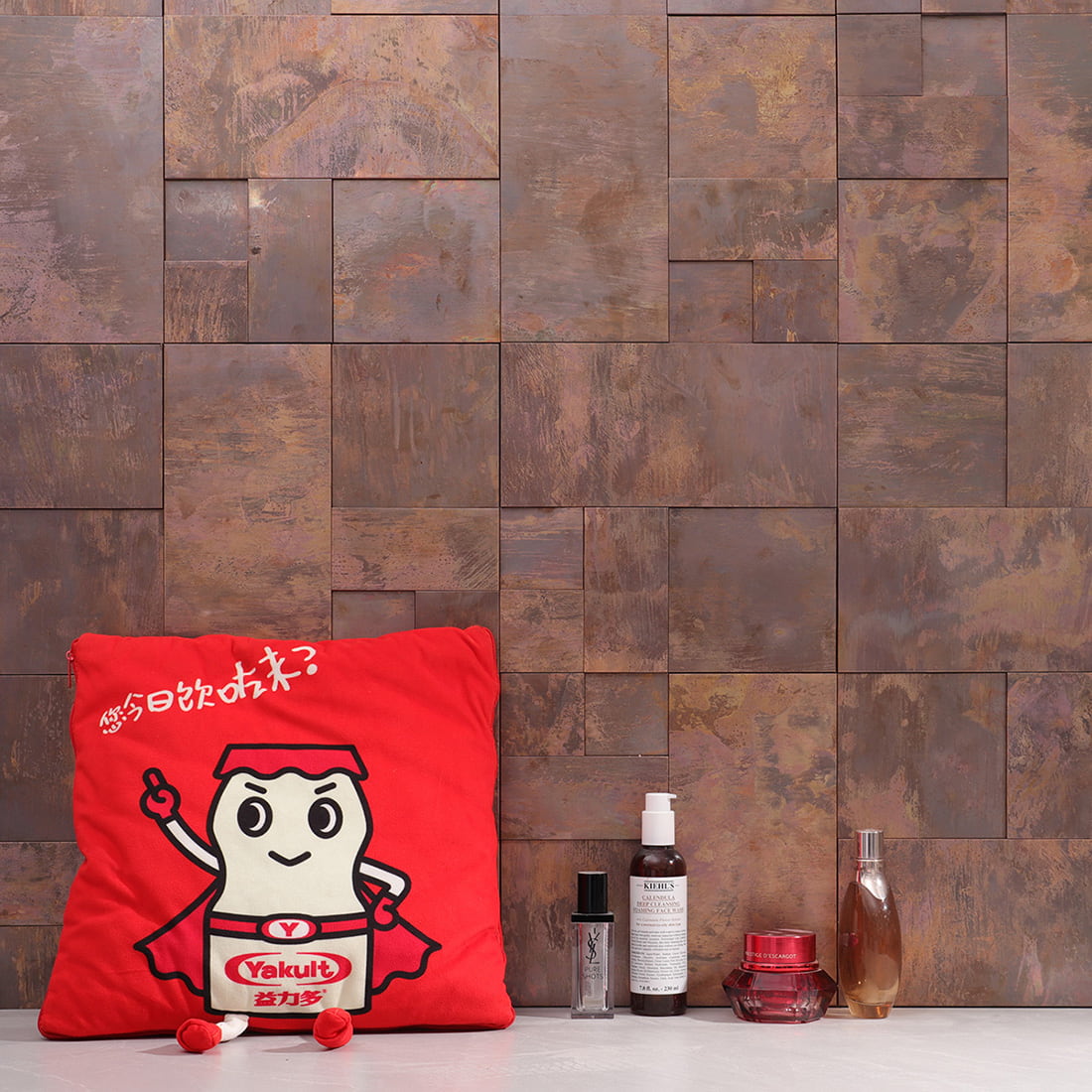 Copper brown metal mosaic feature wall display with mixed size tile pattern