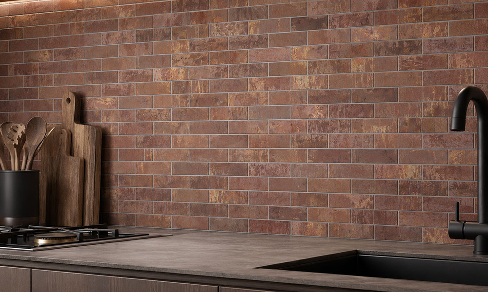 Copper kitchen wall tiles with gray grout in a modern backsplash