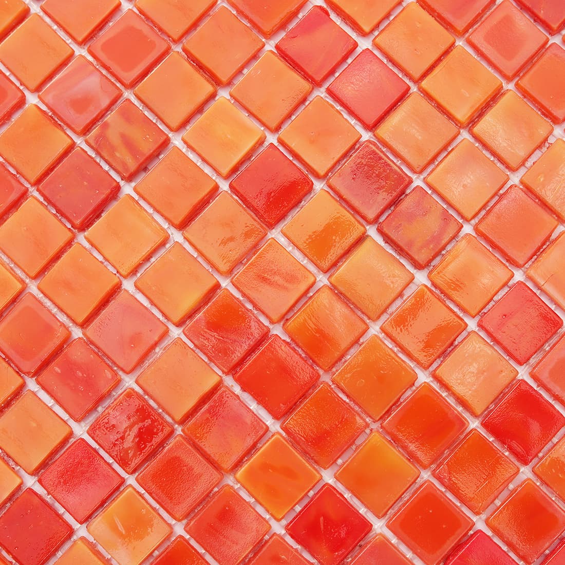 Close-up of coral orange square glass mosaic tile surface