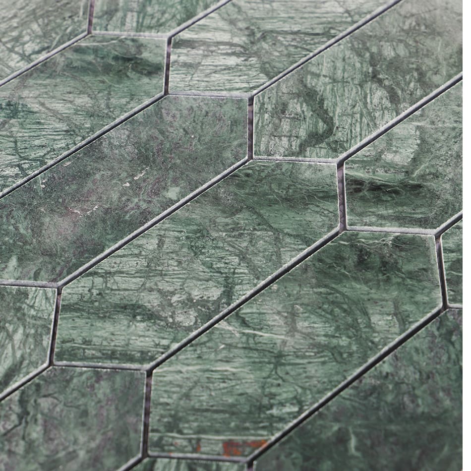 Close-up of dark green elongated hexagon marble mosaic tile pattern