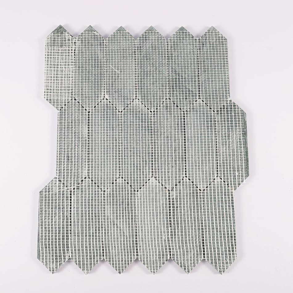 Back view of dark green elongated hexagon marble mosaic tile with mesh backing