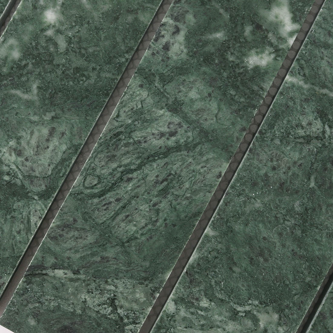 High angle view of dark green linear marble mosaic tiles in parallel