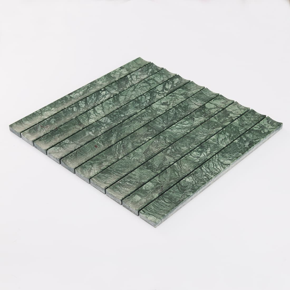 Angled view of dark green marble fluted strip mosaic tile sheet