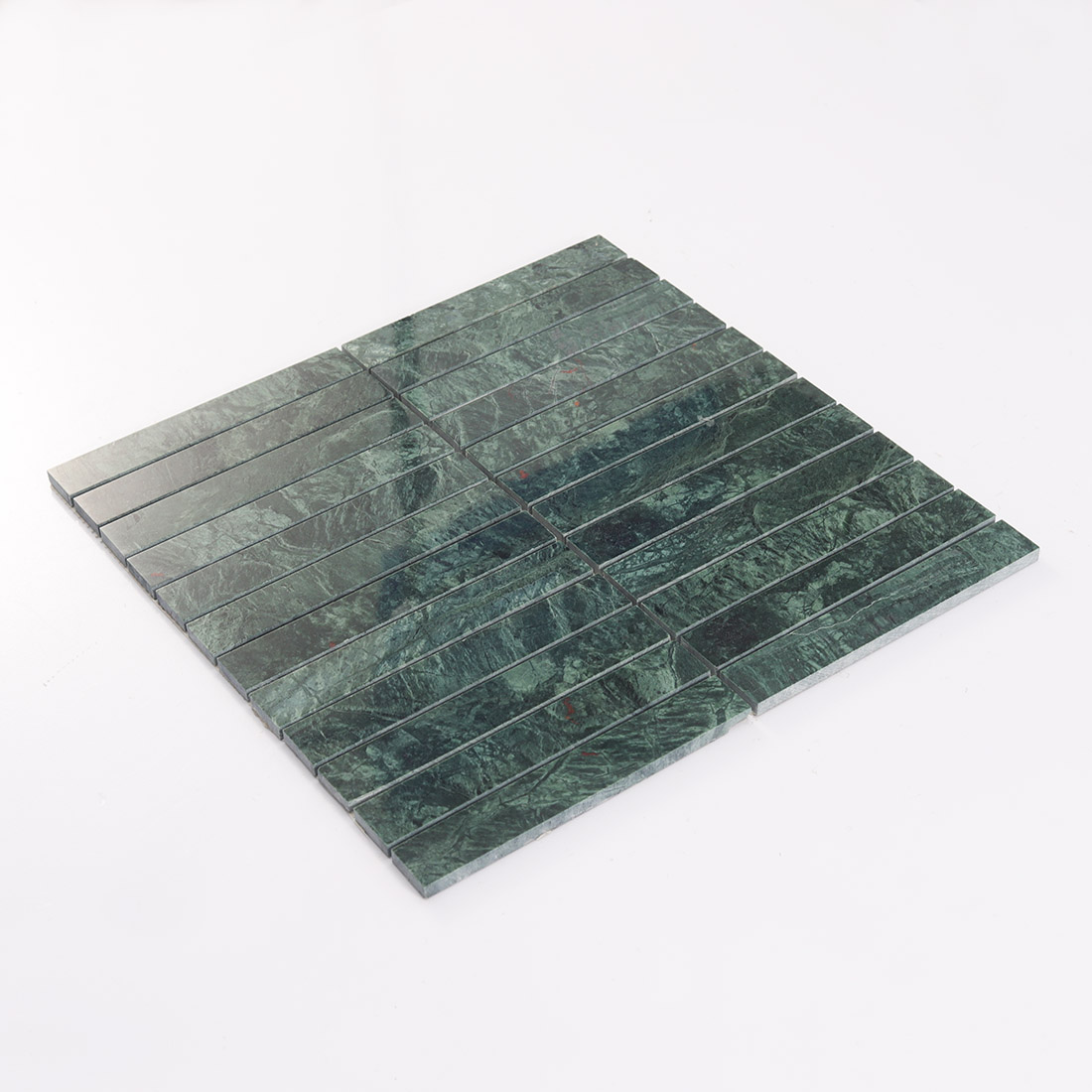 Angled view of dark green marble long strip mosaic tile sheet on white background