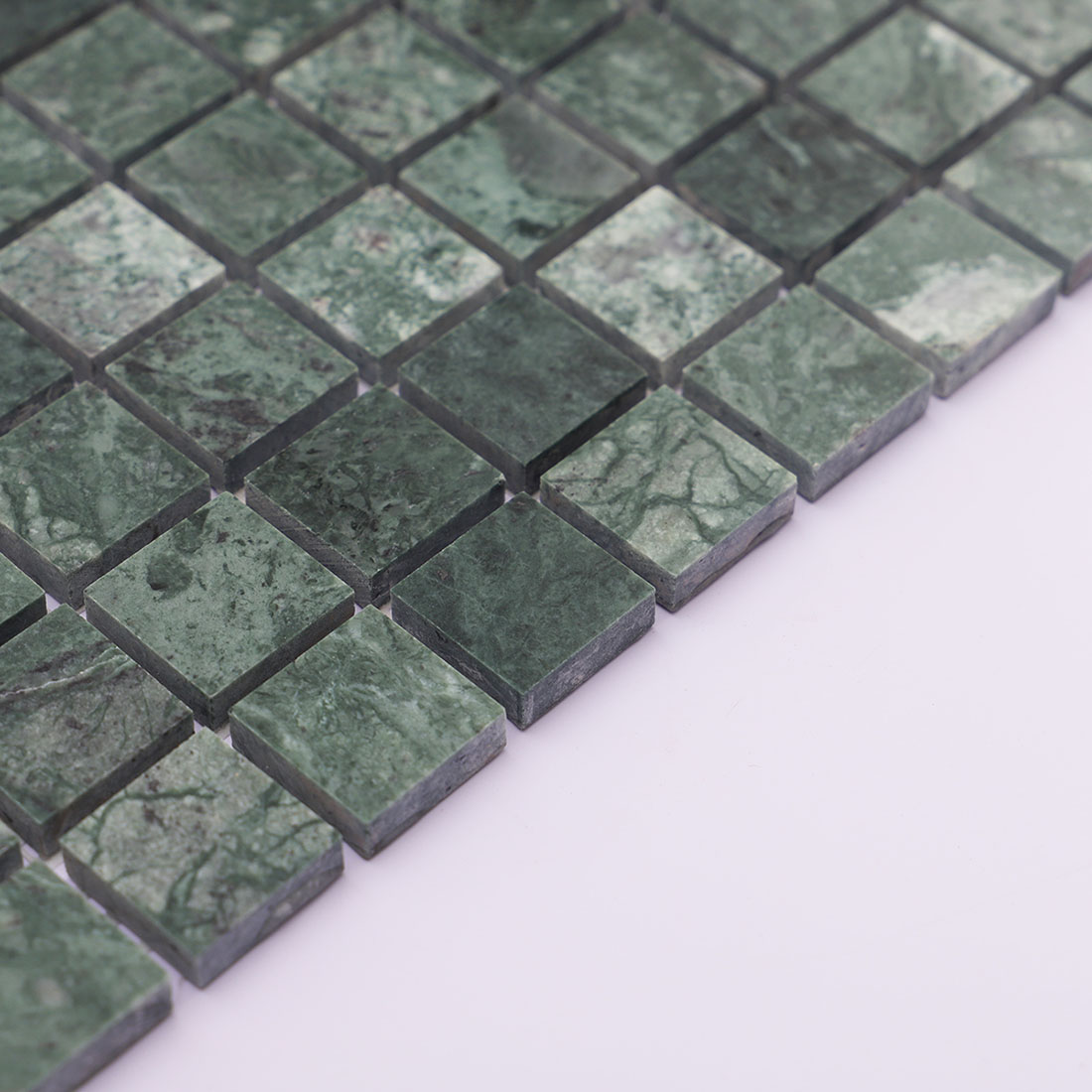 Dark green marble square mosaic tile side view showing thickness and edge detail.