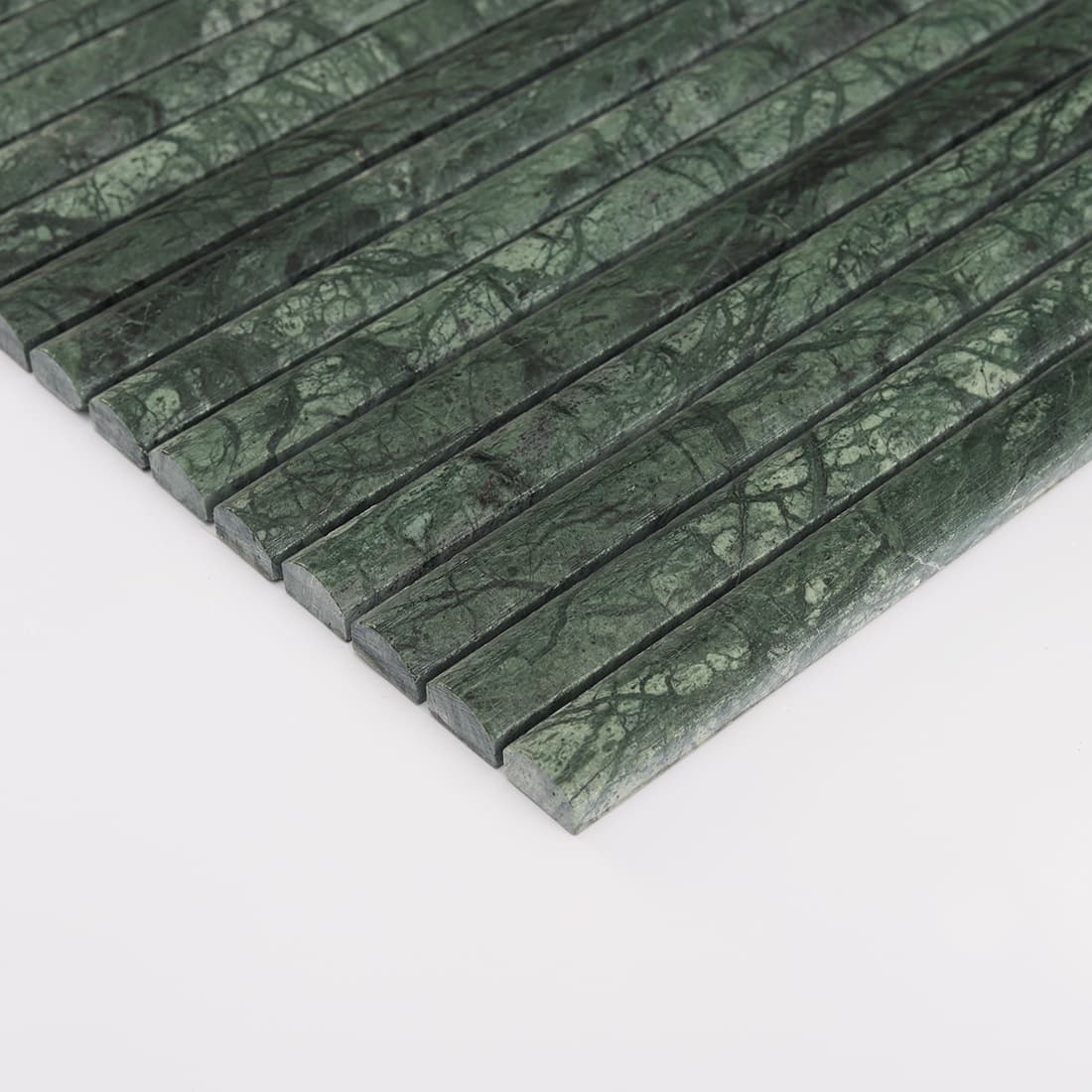 Angled edge view of dark green marble rounded strip mosaic tile