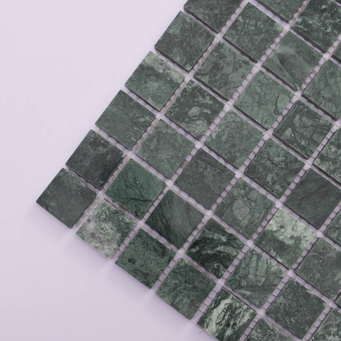 Dark green marble square mosaic tile angled corner view with natural texture.