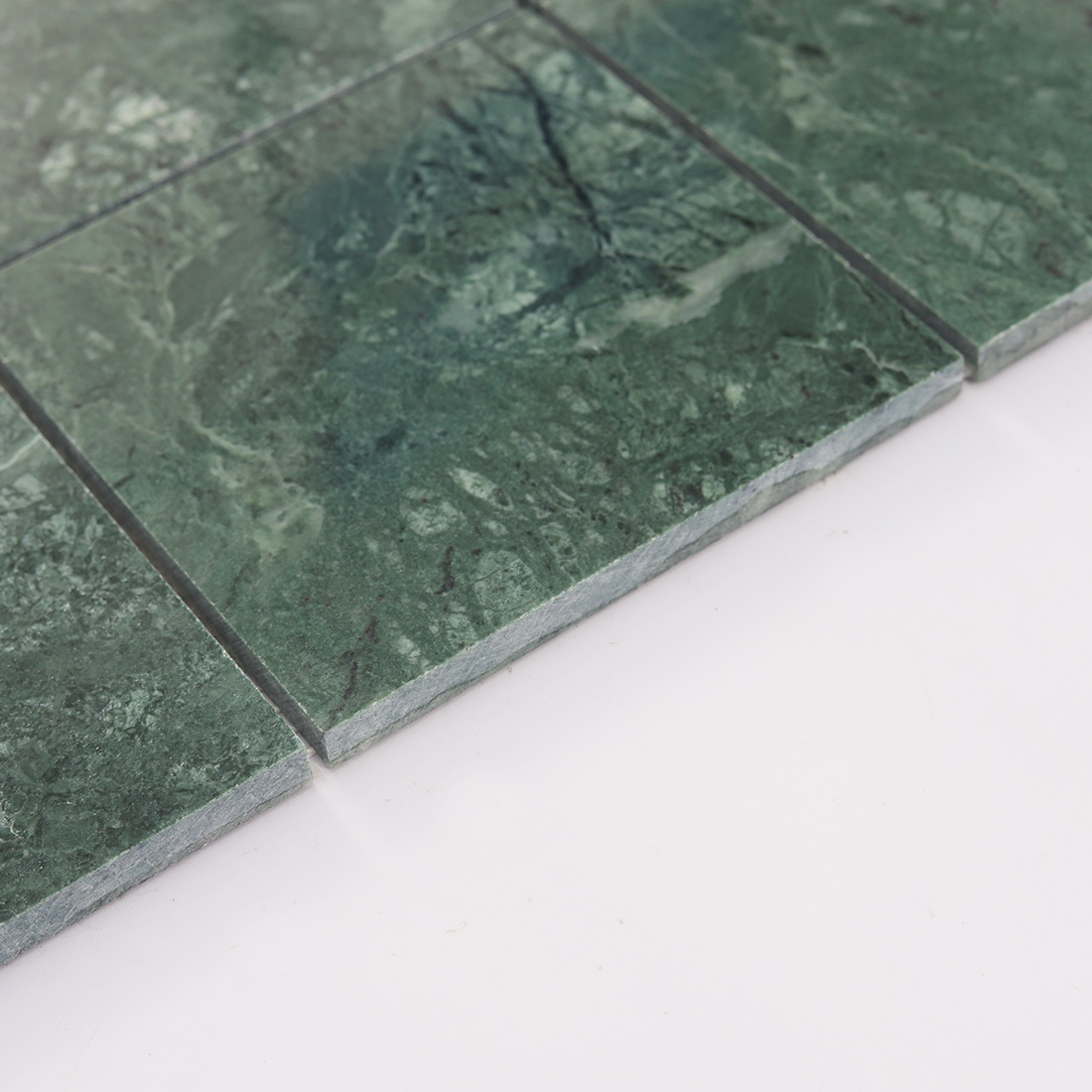 Thick edge detail of dark green marble square tile with stone texture