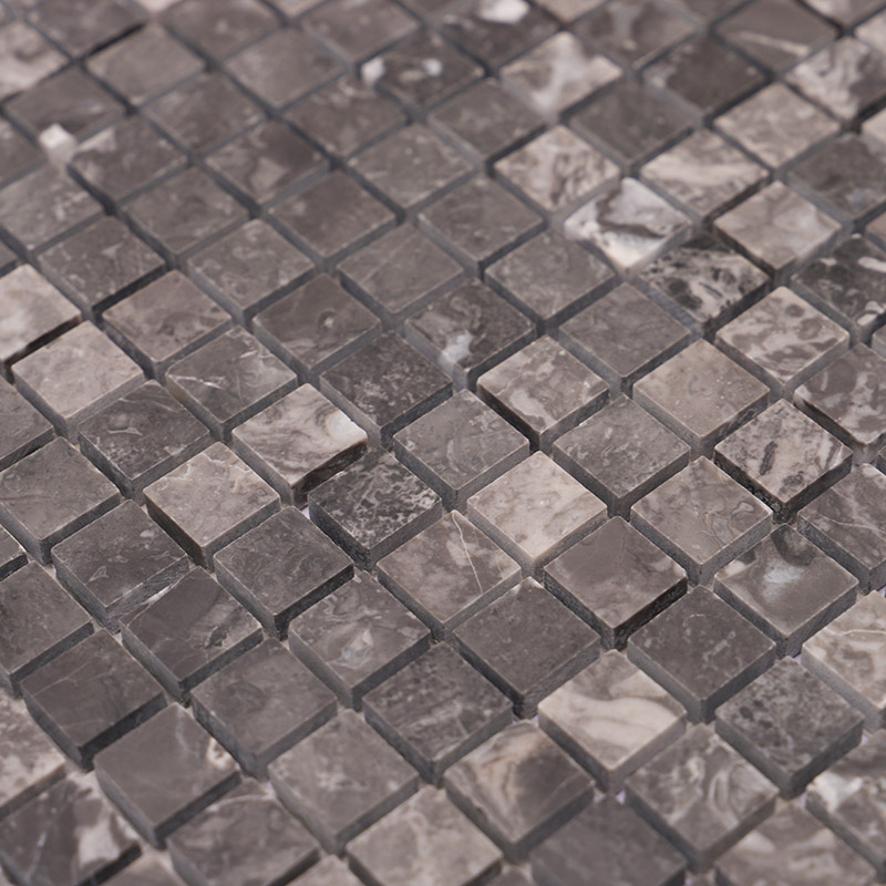 Close-up of dark grey marble mosaic tile squares with natural marble texture