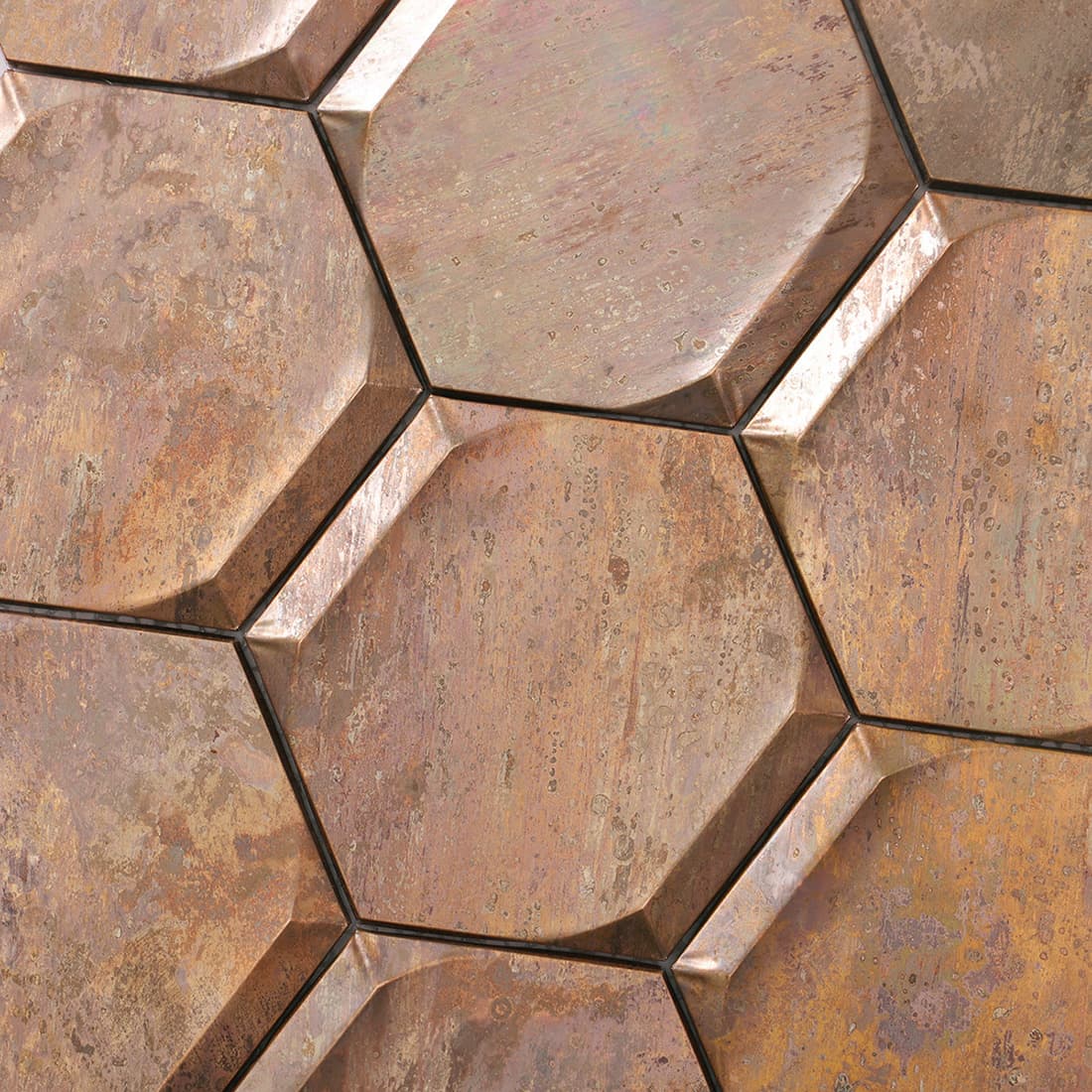 Detailed view of antique copper beveled hexagon metal mosaic tile pattern