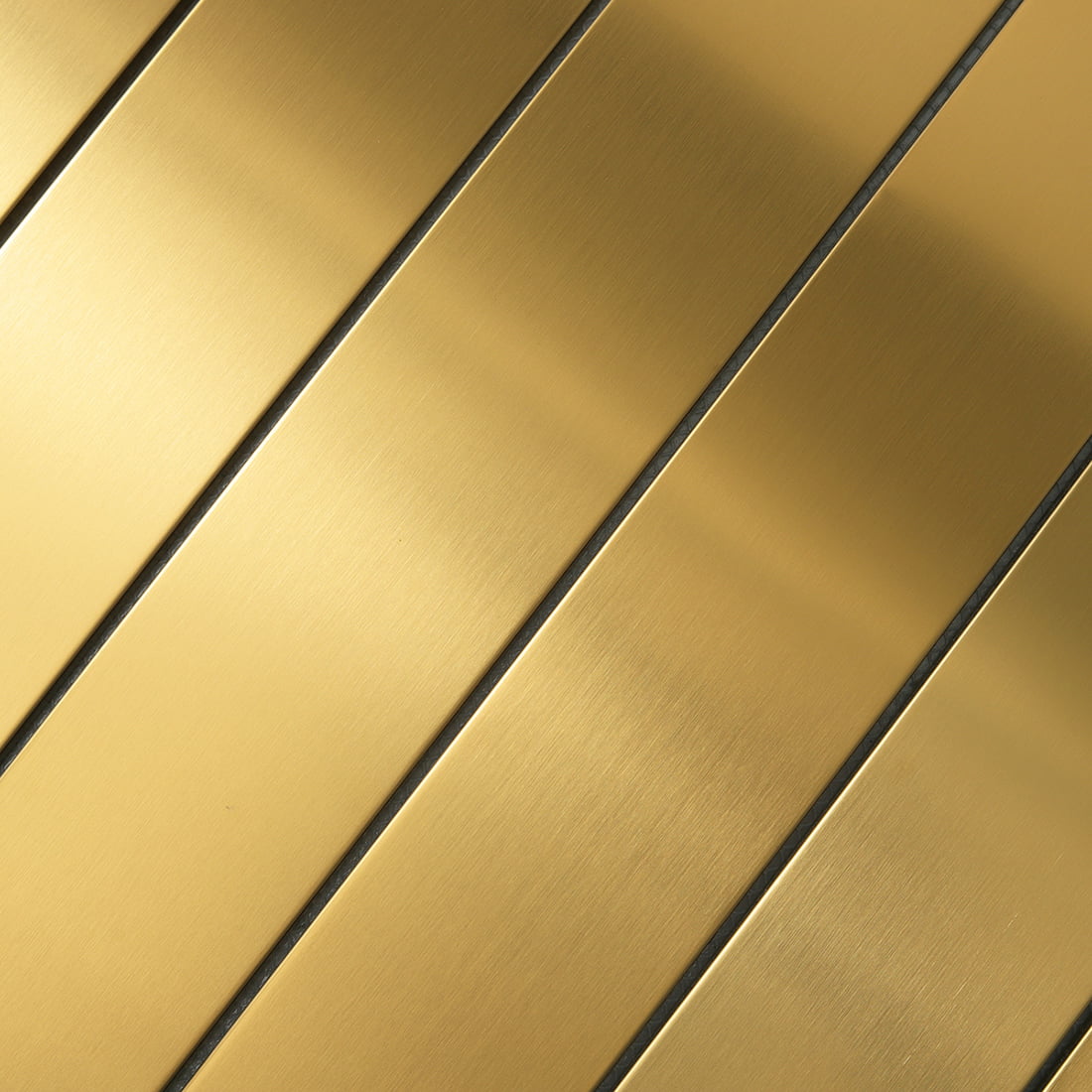 Detailed macro shot of gold brushed stainless steel tile grain.