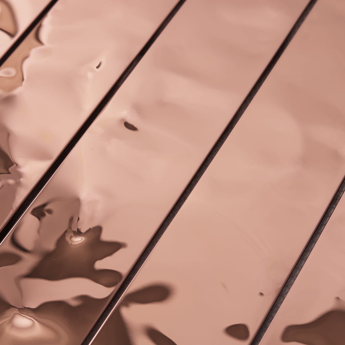 Detailed view of the 3D water ripple texture on rose gold stainless steel.