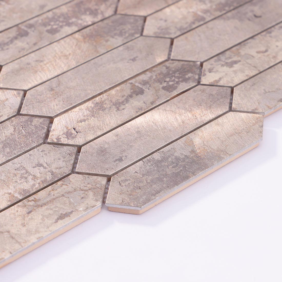 Angle shot of distressed antique silver picket aluminum mosaic tile showing edge