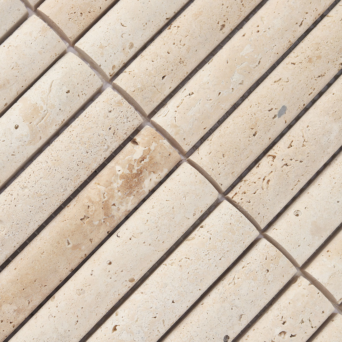 Detailed surface texture and natural pits of beige travertine stone.