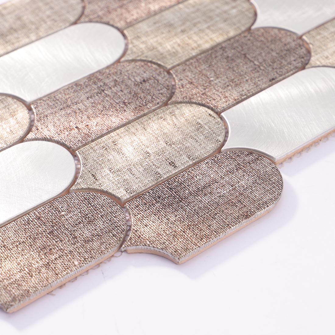 Angle shot of fish scale arched aluminum mosaic tile showing smooth edge