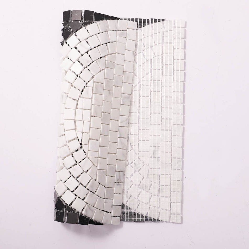 Flexible black and white marble mosaic tile sheet showing curved design.
