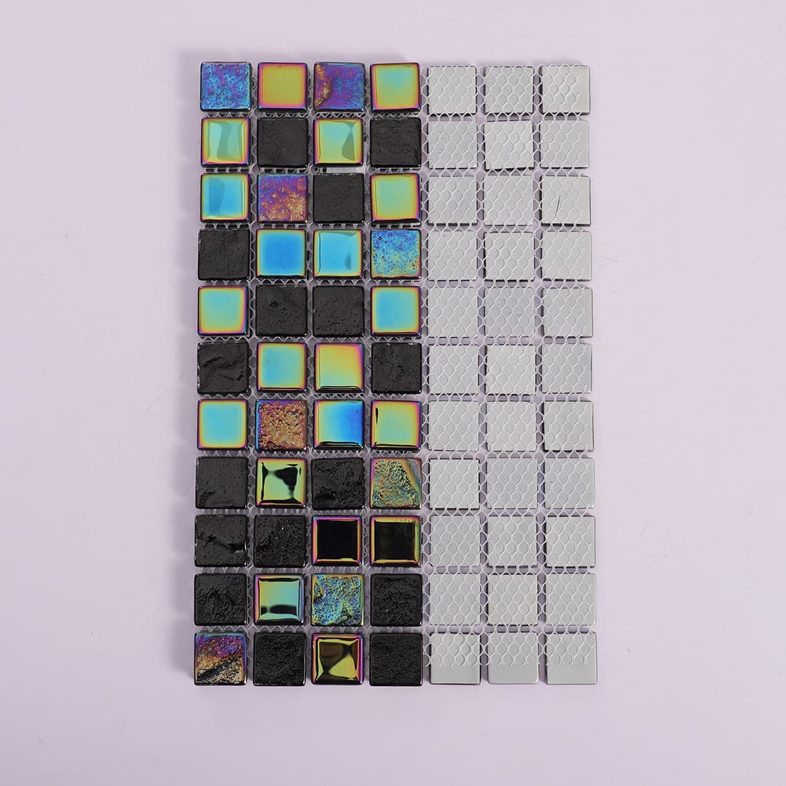 Front view and mesh backing of a black iridescent mosaic tile sheet.