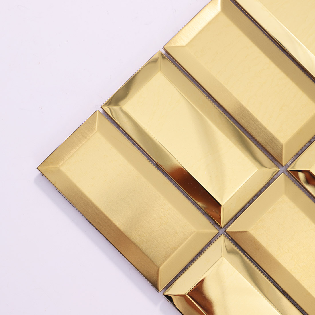 Close-up of gold 3D rectangle stainless steel mosaic tile corner