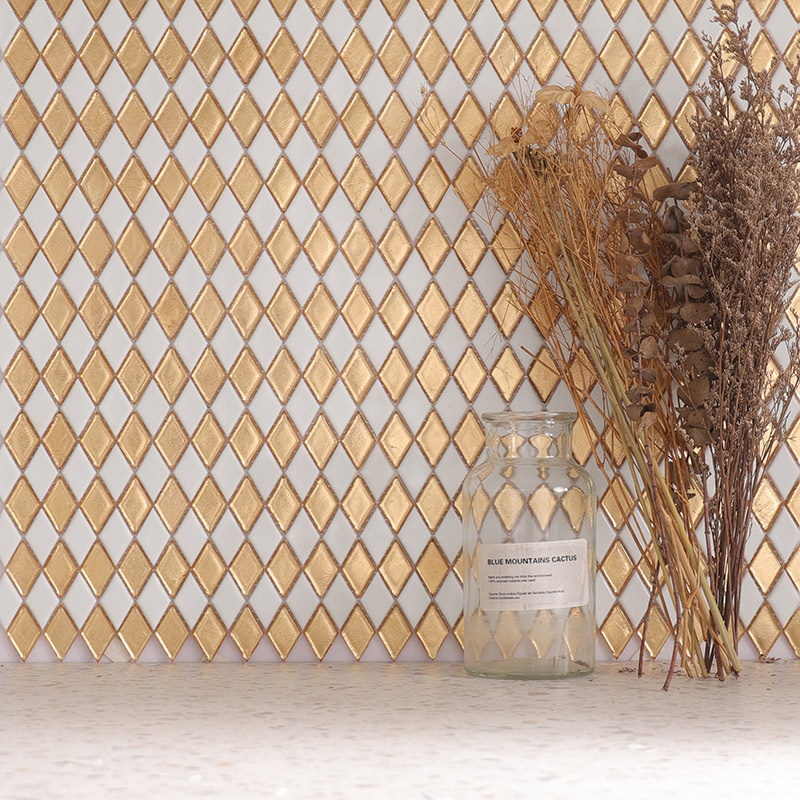 Gold and white rhombus mosaic tiles used as a backsplash with vase decor.