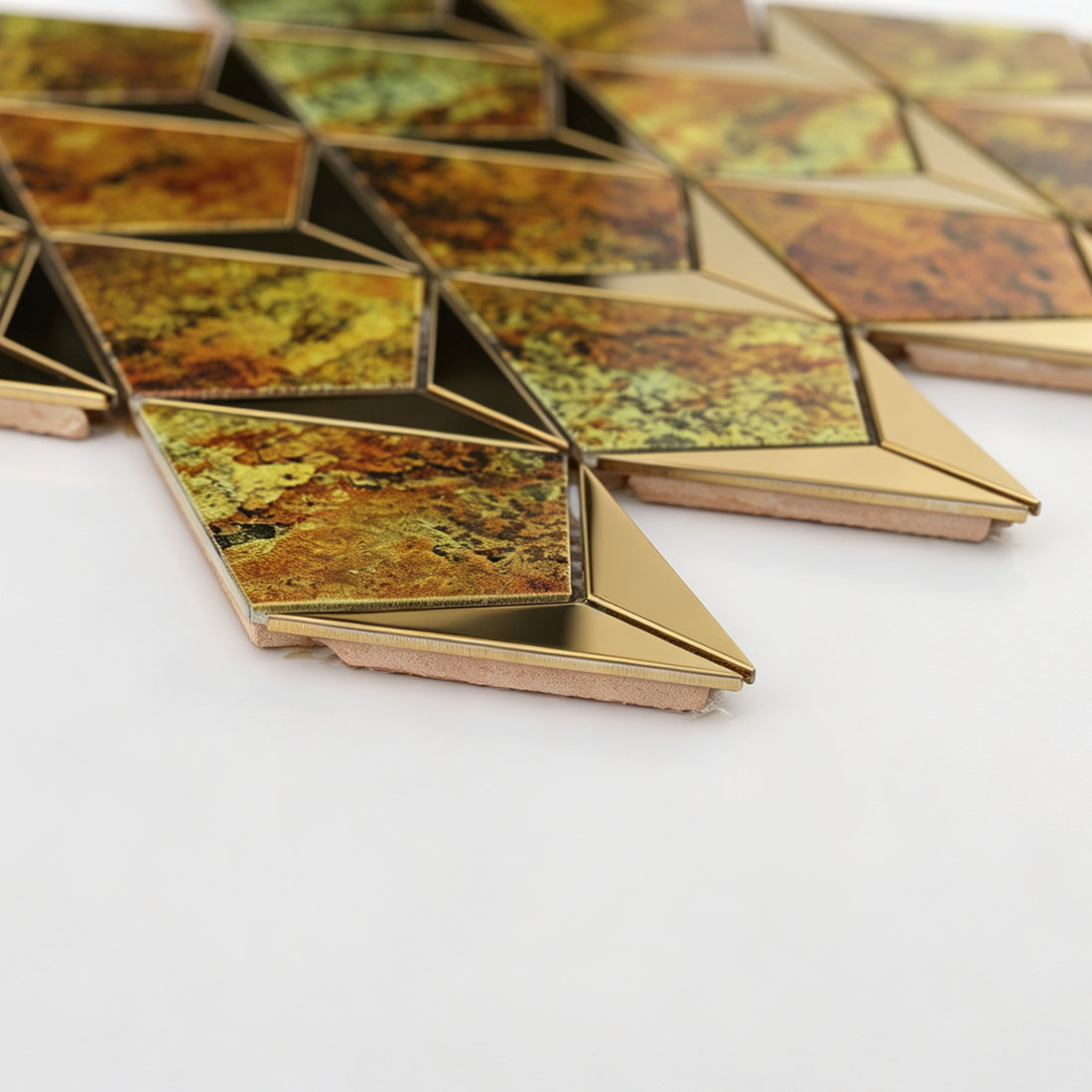 Side view of gold antique kite-shaped metal mosaic tiles showing the tile base