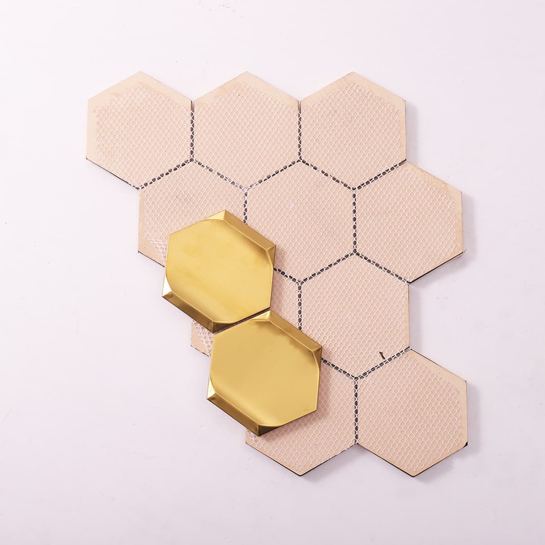 Side and mesh backing view of gold hexagon stainless steel mosaic tile