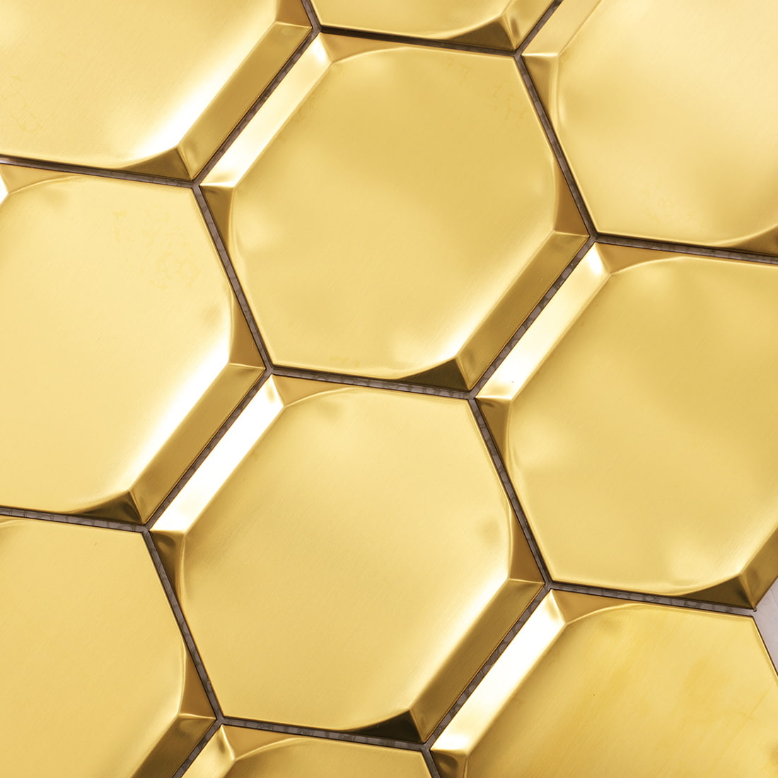 Close-up of gold brushed 3D hexagon stainless steel mosaic surface
