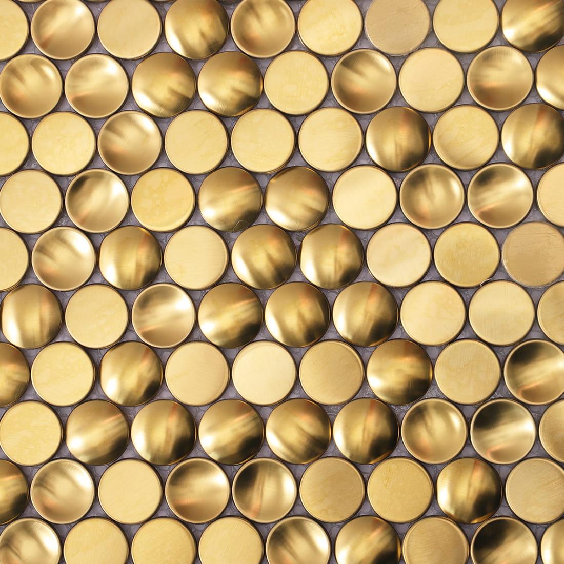 Detailed surface view of gold circular metallic mosaic tiles.