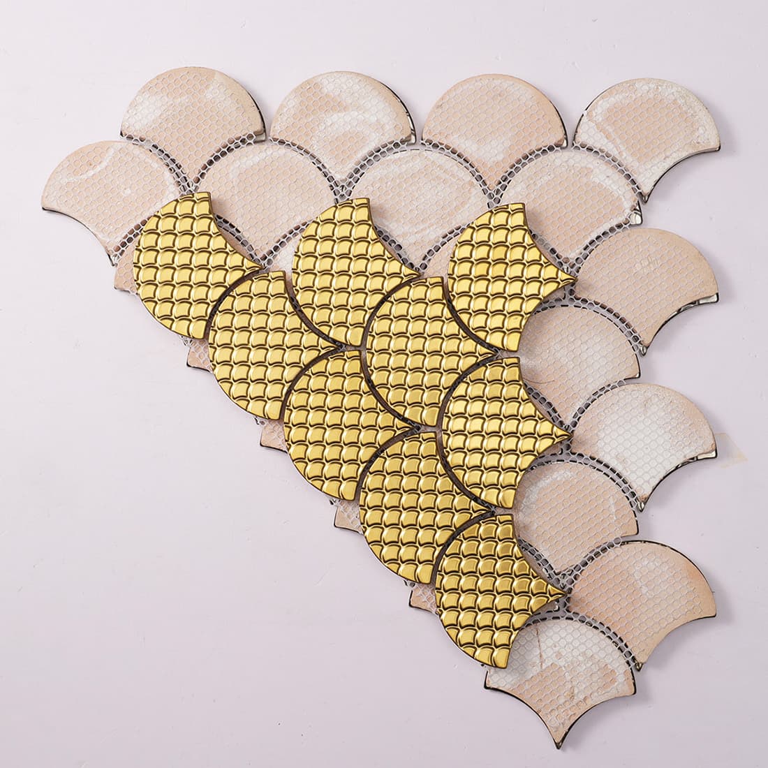 Back view of gold fish scale metal mosaic tile with mesh backing