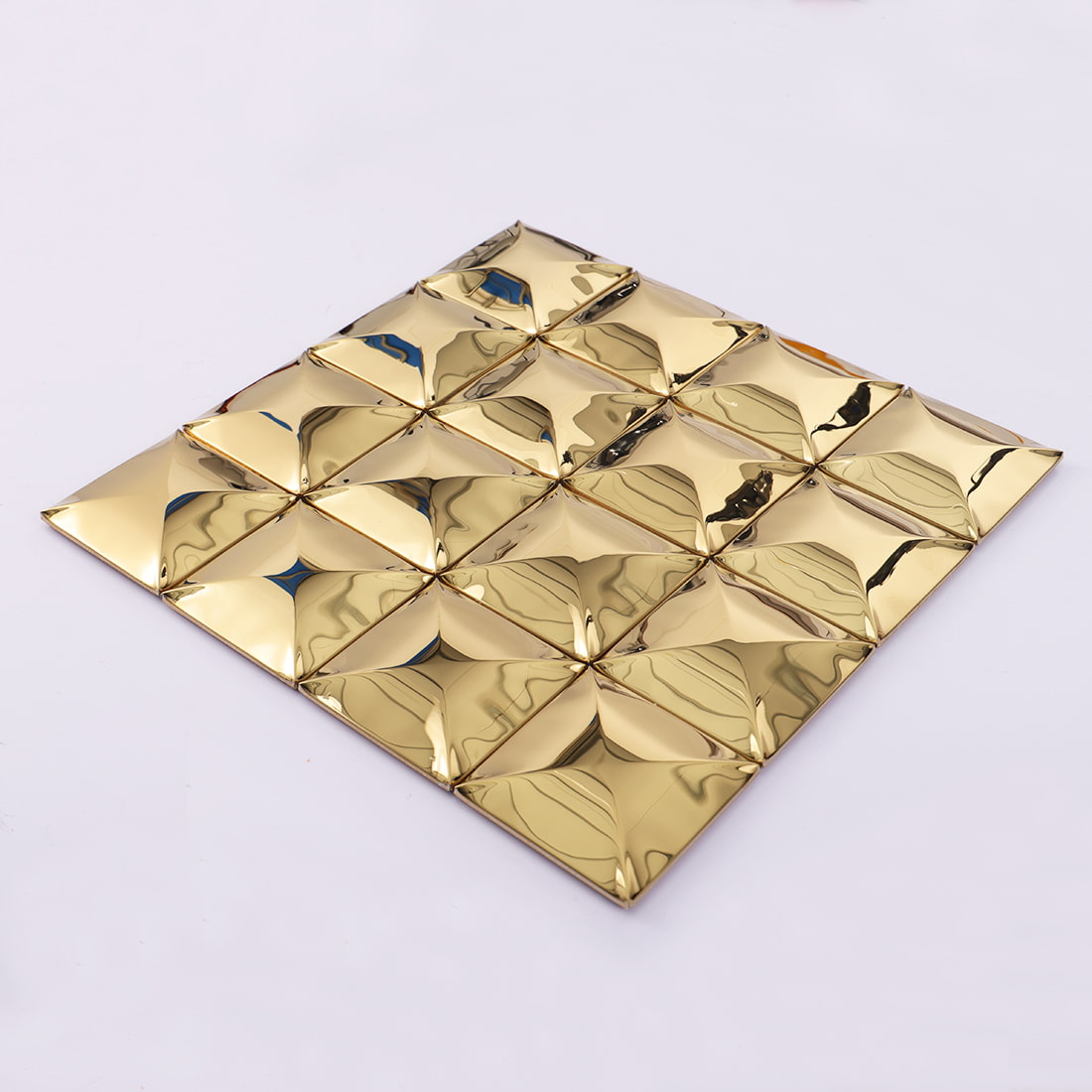 Angled sheet view of gold glossy square 3D metal mosaic tile