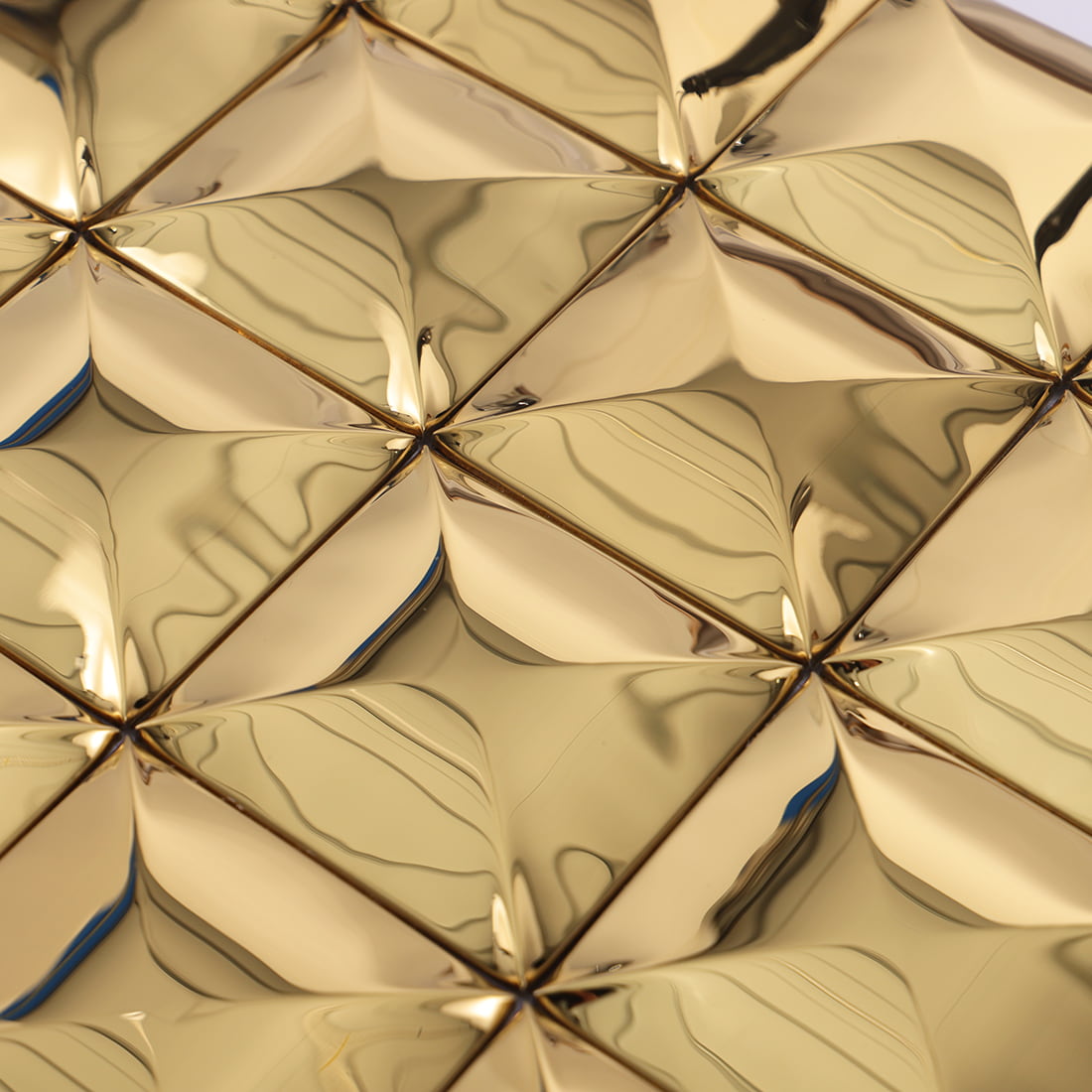 Close up of gold glossy square 3D metal mosaic tile surface