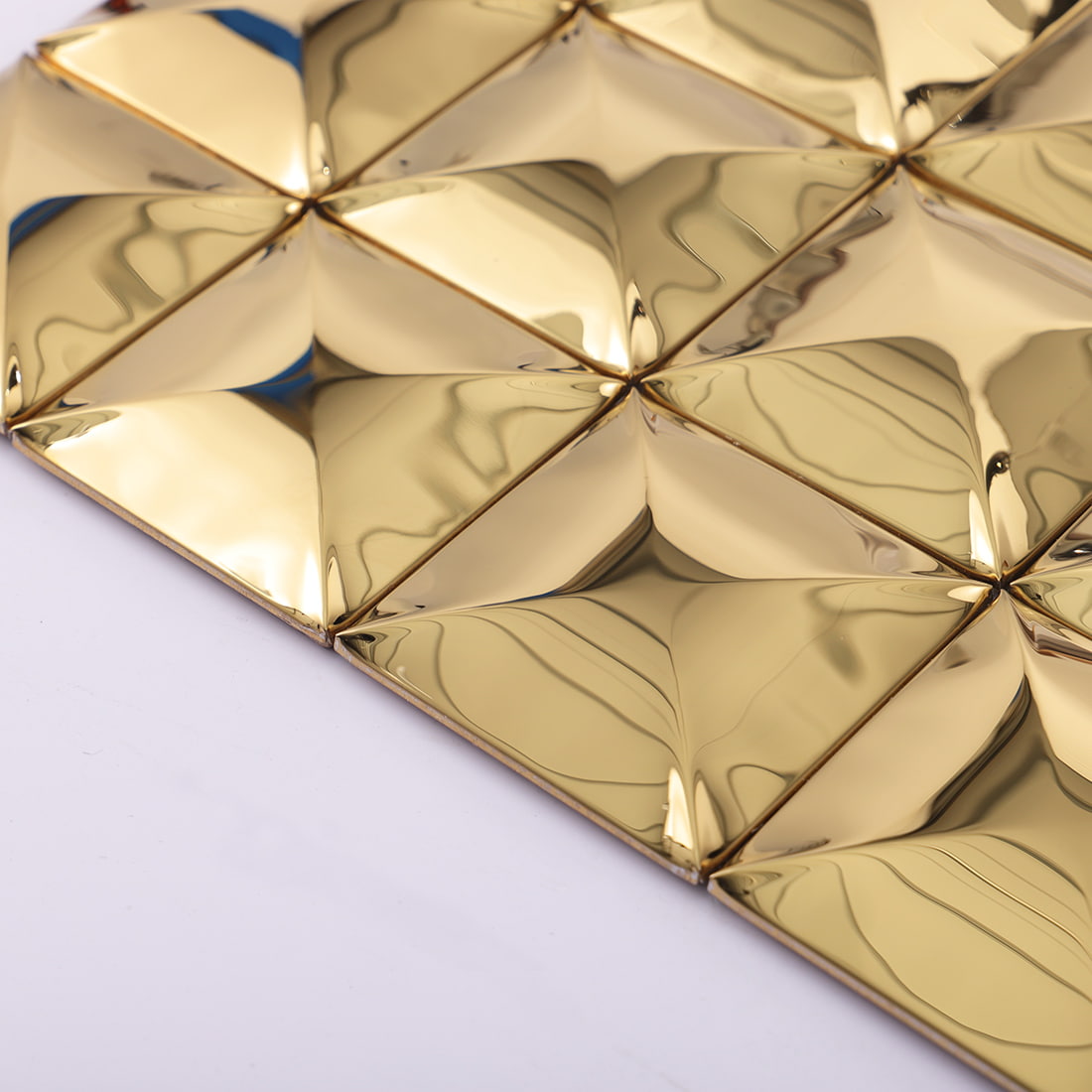 Edge view of gold glossy square 3D metal mosaic tile sheet