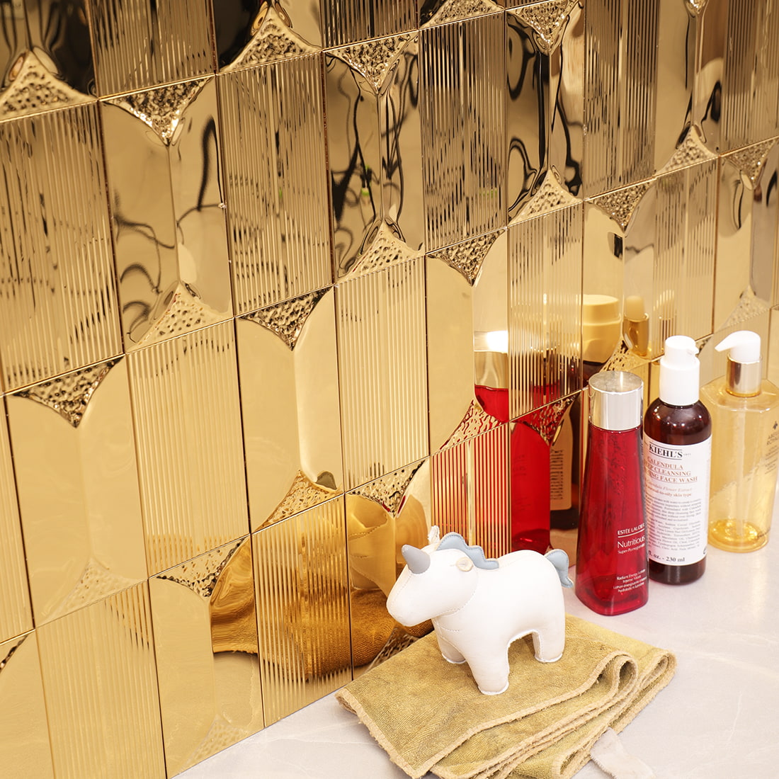 Gold glossy textured rectangular metal mosaic tile bathroom display