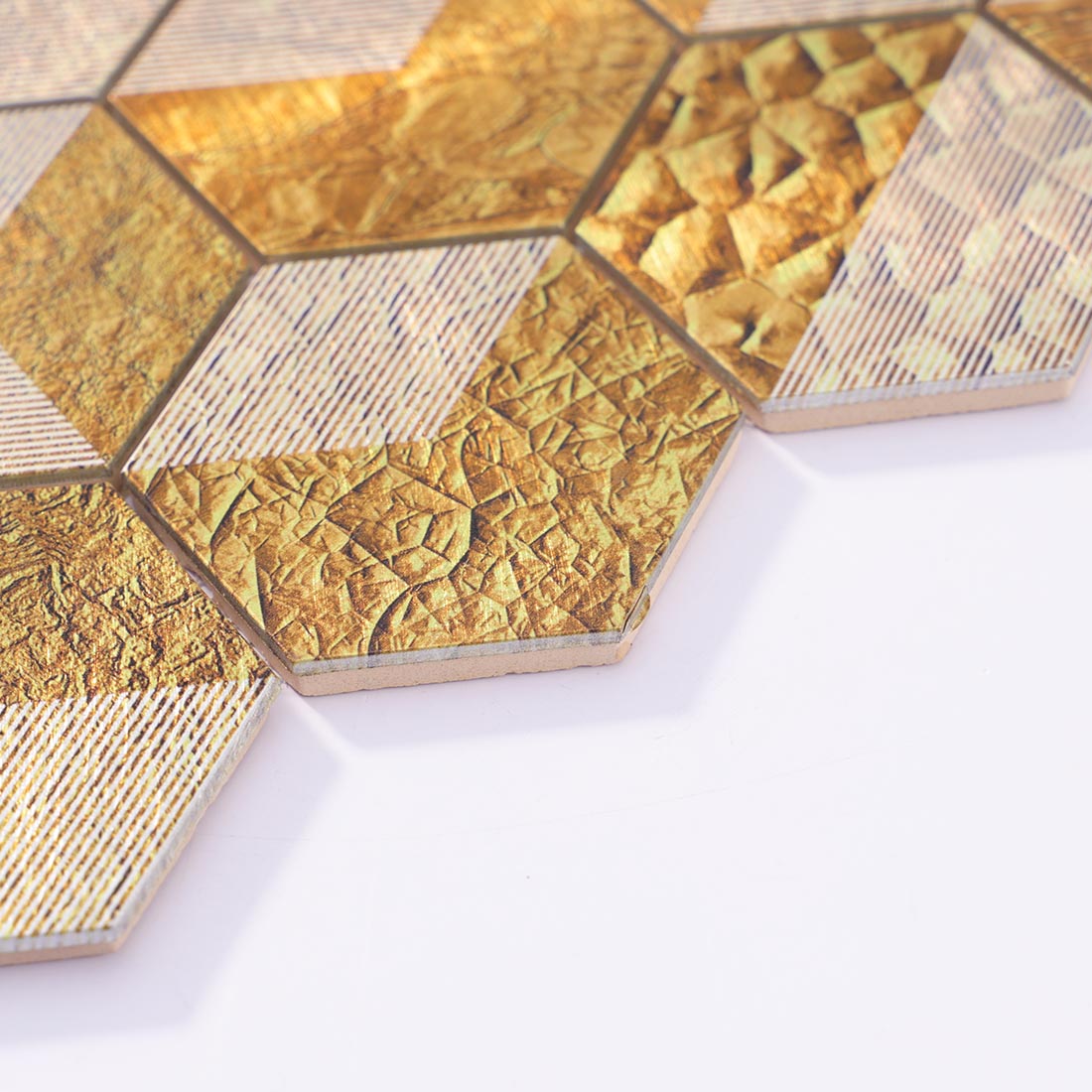 Angle shot of gold hexagon aluminum mosaic tile showing metallic edge