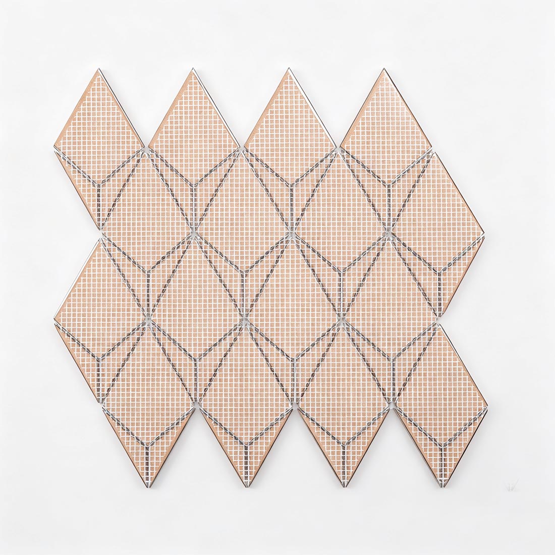Mesh mounted backing of gold kite-shaped metal mosaic tile for easy installation
