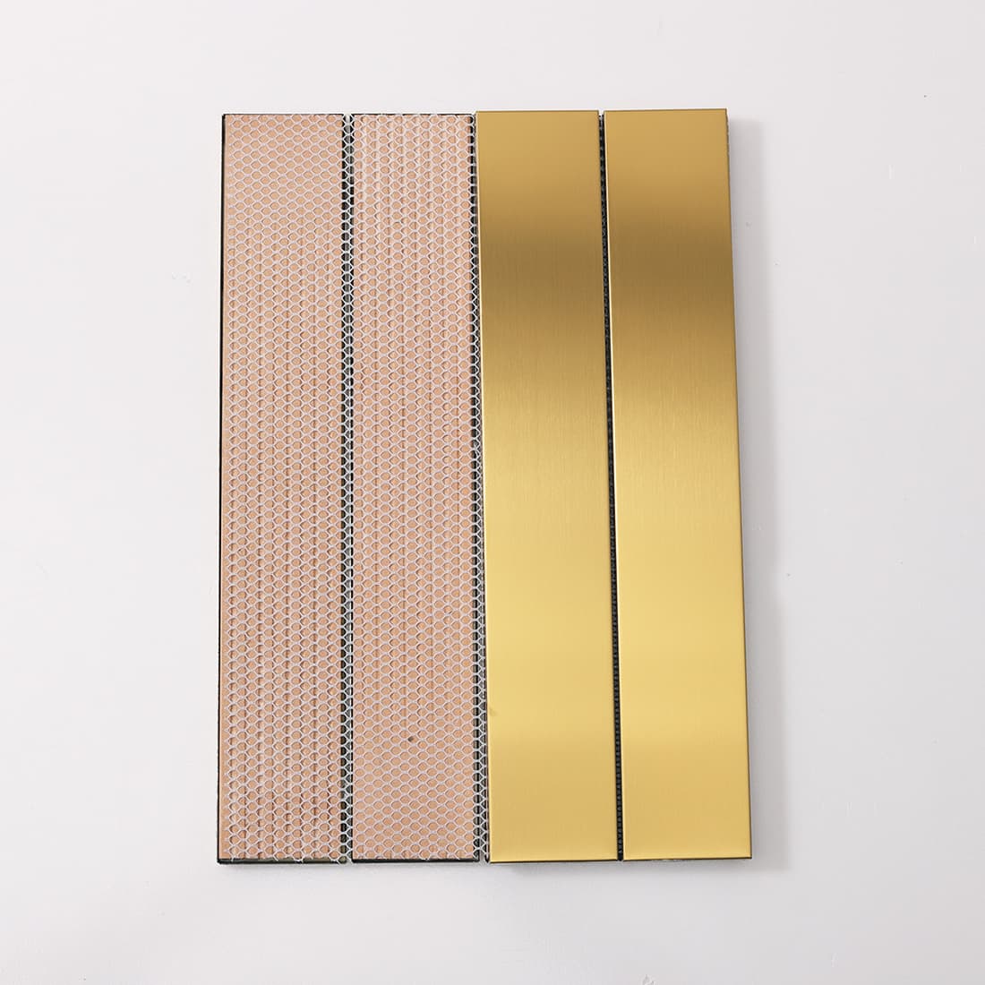 Front and back view of gold linear tile showing mesh backing.