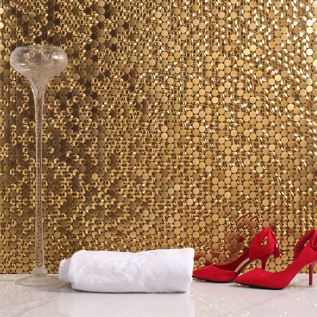 Luxurious gold penny round mosaic tile wall application.