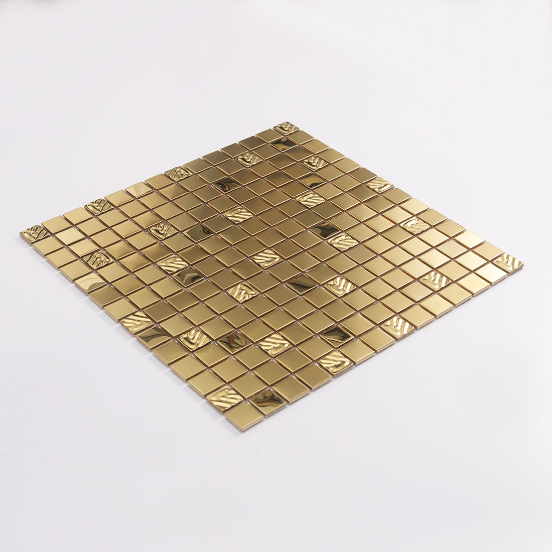 Perspective view of gold square metal mosaic tile sheet with random textured accents