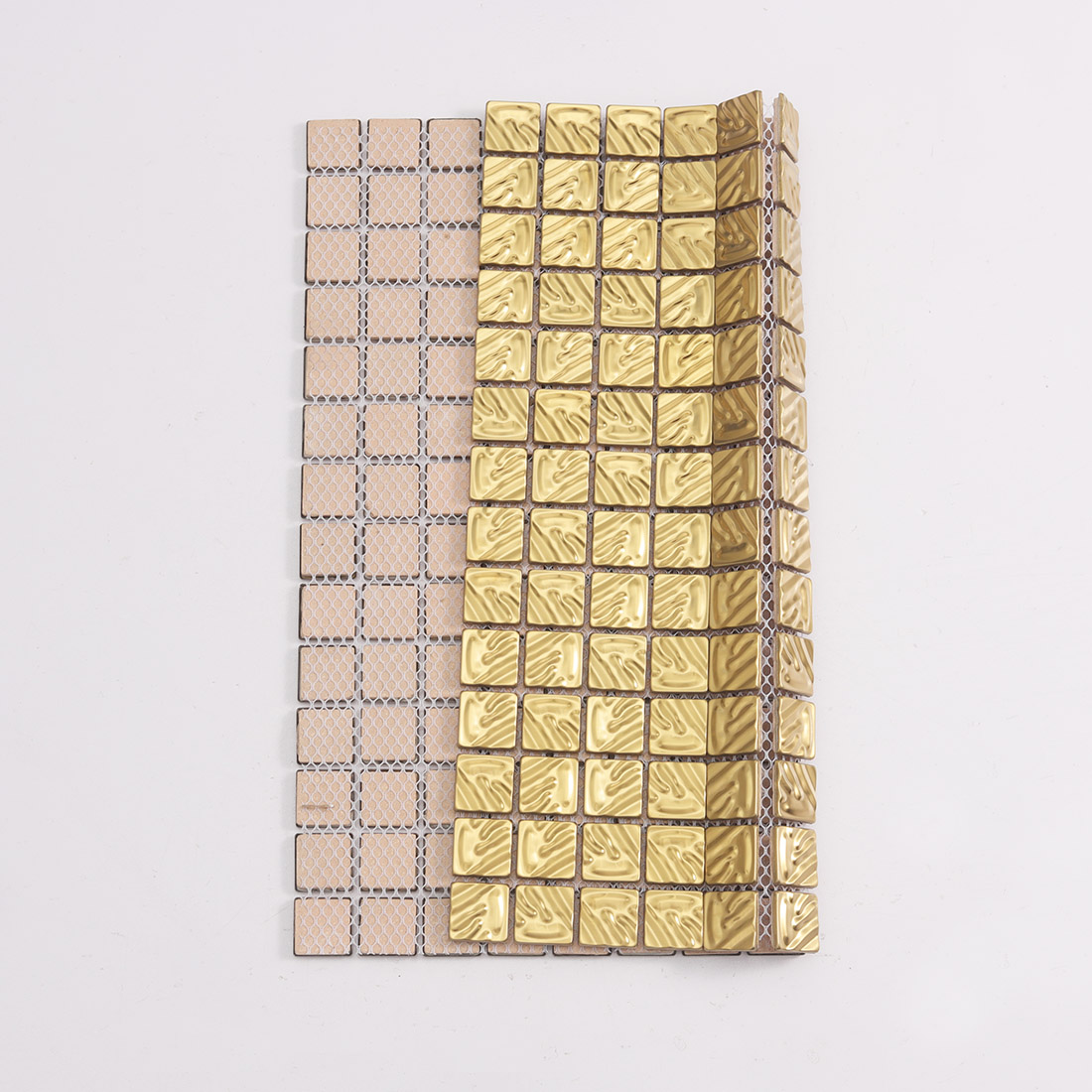 Gold stainless steel mosaic tile showing front wavy surface and mesh backing