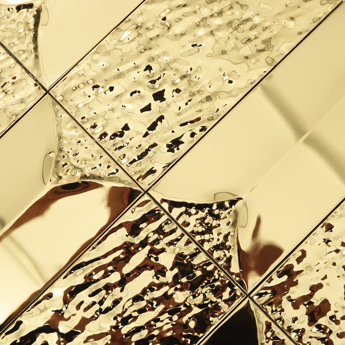 Gold textured rectangular metal tile with reflective 3D surface
