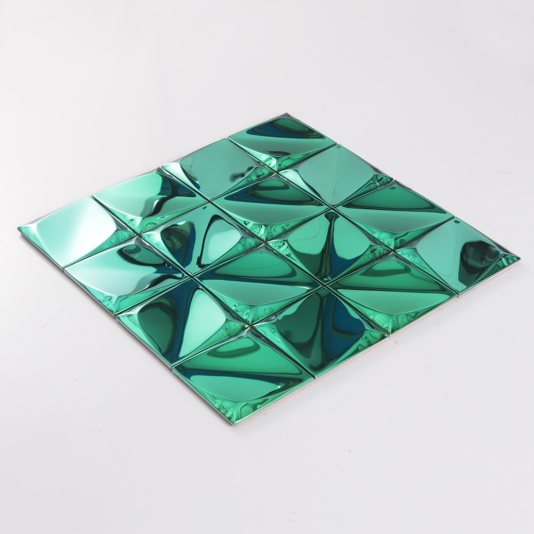Perspective display of green 3D square metal tiles with mirror reflections