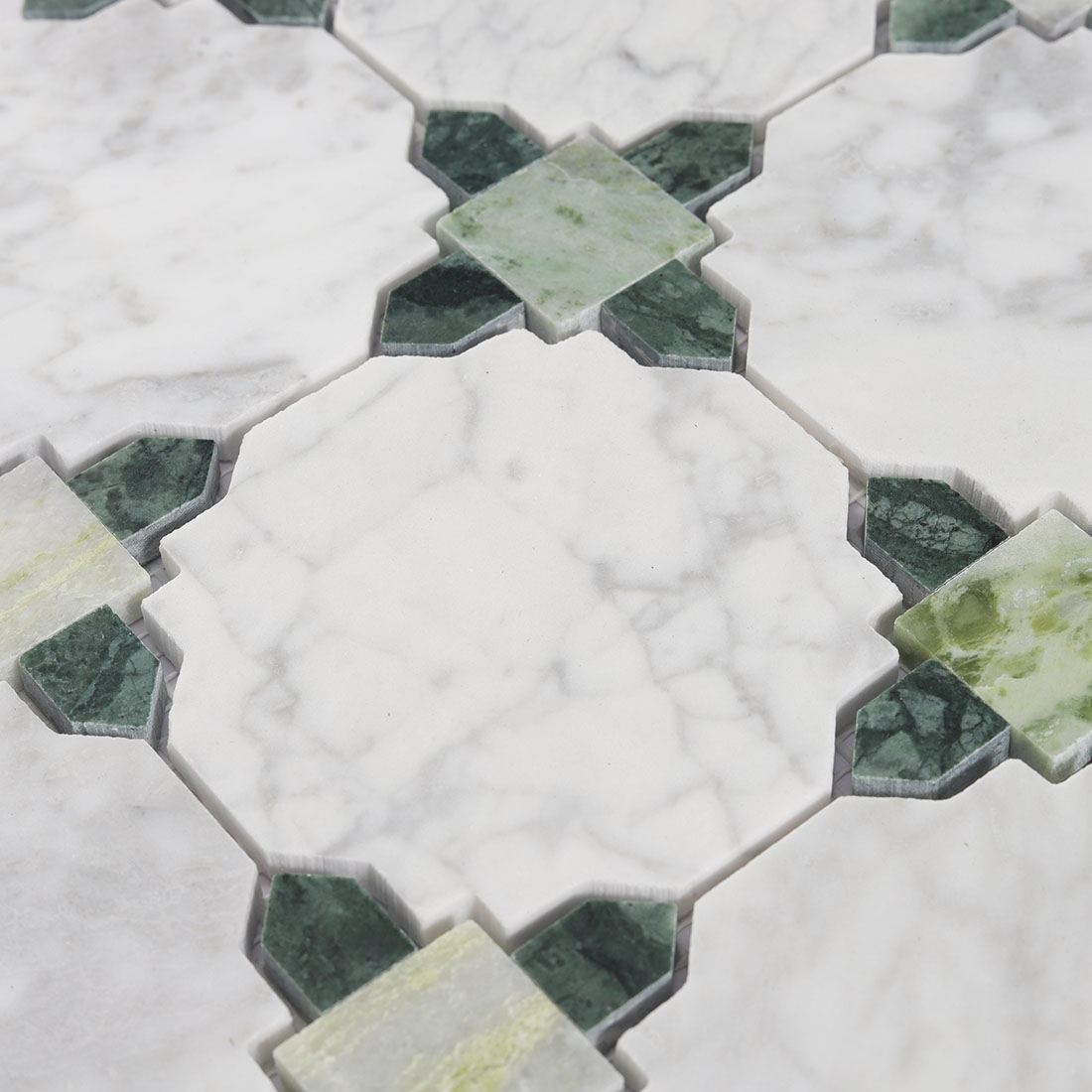 White octagon marble mosaic close up with green square and diamond accent pattern